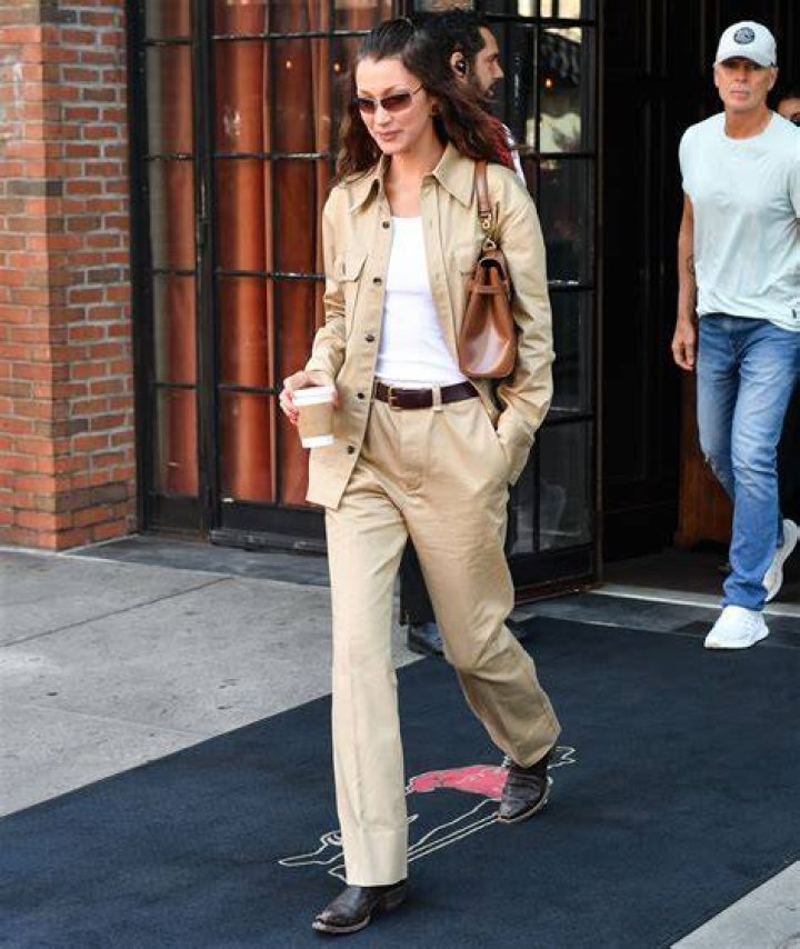 Bella Hadid steps out in Miami in a pair of Dr.Martens boots and a summer dress with friend Hailey Baldwin. The models headed to popular Yardbird for some southern style cooking. Baldwin showed off her long legs and toned stomach in a pair of daisy dukes denim shorts and a crop top.Pictured: Hailey BaldwinRef: SPL1686468 300418 Picture by: Splash NewsSplash News and PicturesLos Angeles:310-821-2666New York:212-619-2666London: