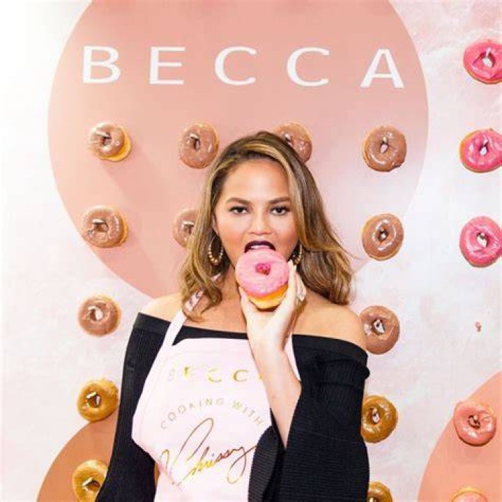 Chrissy Teigen Eating A Donut