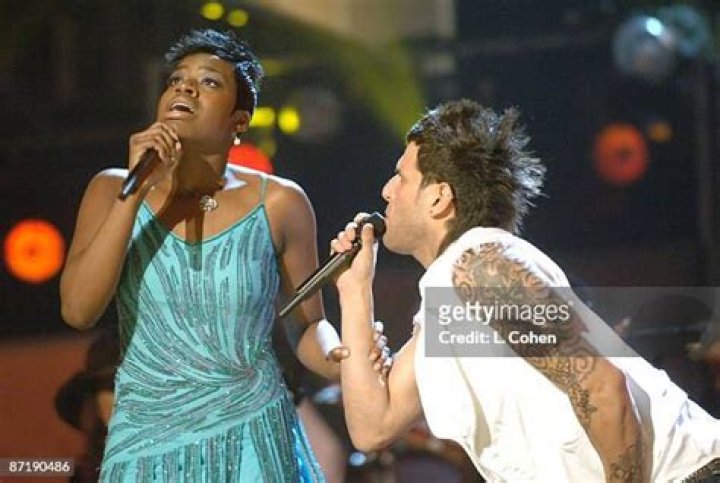 Fantasia and Devin Lima perform "If You Want Me to Stay" during a special tribute to legendary funk band Sly and the Family Stone at the 48th Annual Grammy Awards on Wednesday, Feb. 8, 2006, in Los Angeles. (AP Photo/Mark J. Terrill)