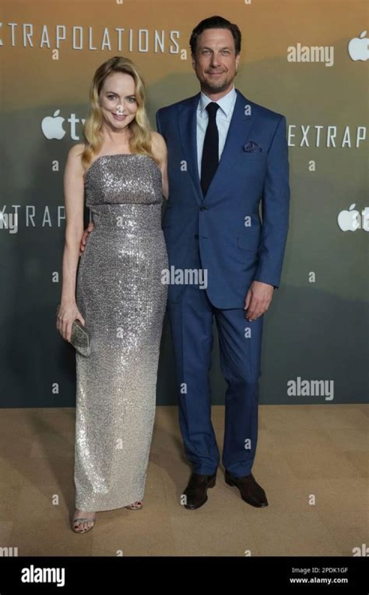 Heather Graham, left, and John de Neufville arrive at the Los Angeles premiere of "Extrapolations,", at The Hammer Museum LA Premiere of "Extrapolations", Los Angeles, United States - 14 Mar 2023