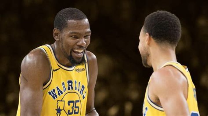 Kevin Durant and Stephen Curry Cleveland Cavaliers at Golden State Warriors, Oakland, USA - 12 Jun 2017 Golden State Warriors player Kevin Durant (L) laughs with teammate Stephen Curry (C) holding one of his daughters while celebrating after winning the NBA Finals against the Cleveland Cavaliers in game five of the NBA Finals.